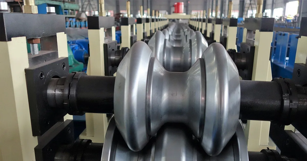 Paired steel rolls on shafts along a roll forming line, the tooling made by roll forming rolls machining